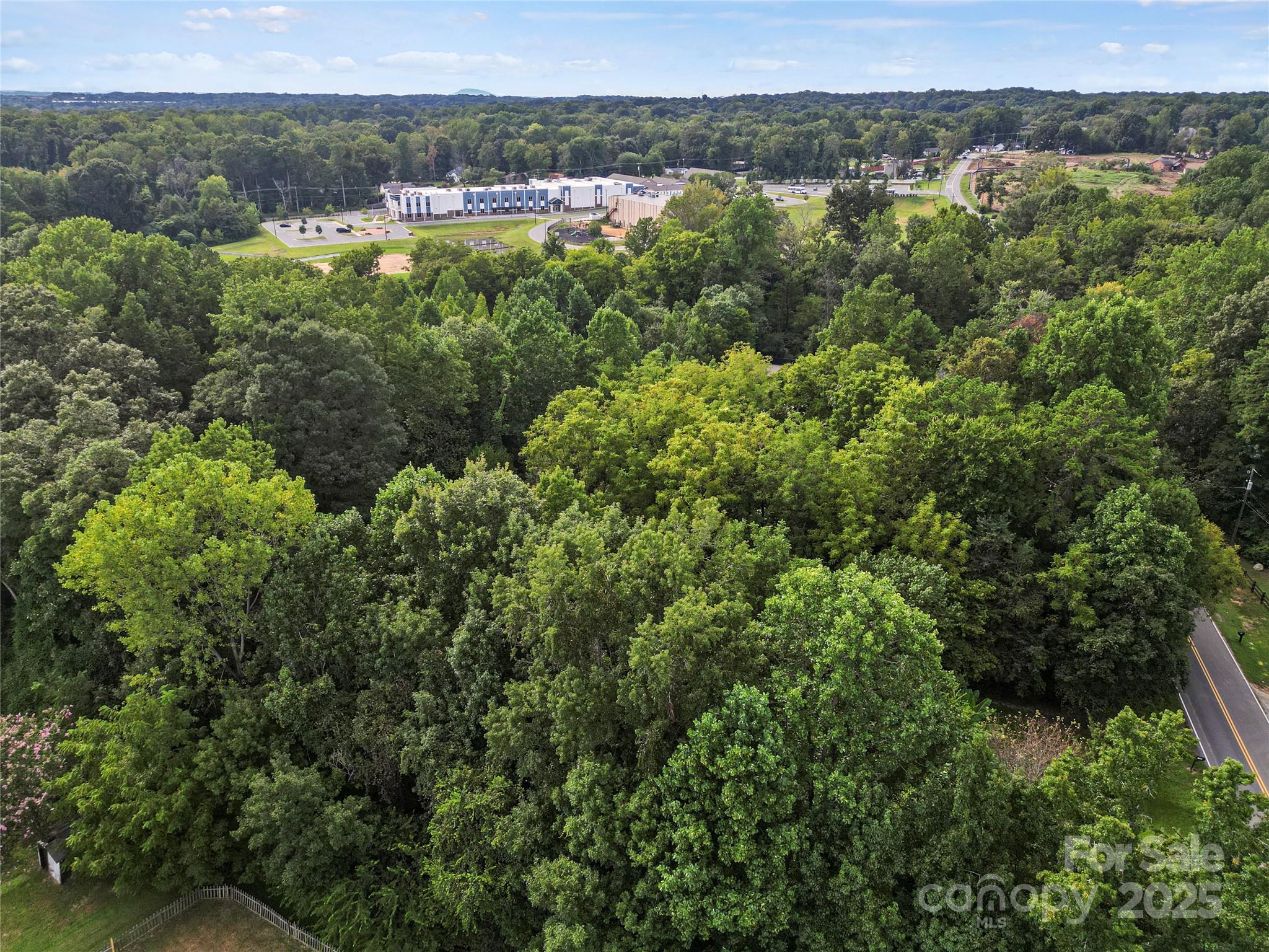 6109 Paw Creek Road Charlotte, NC 28214 - Photo 11 of 18 an aerial view of residential houses with outdoor space and trees