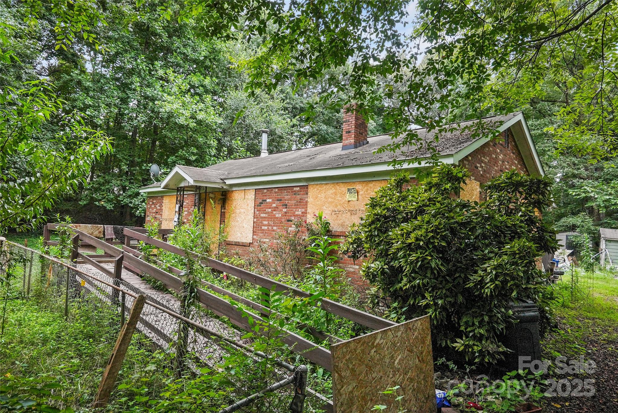 6109 Paw Creek Road Charlotte, NC 28214 - Photo 18 of 18 a backyard of a house with lots of green space