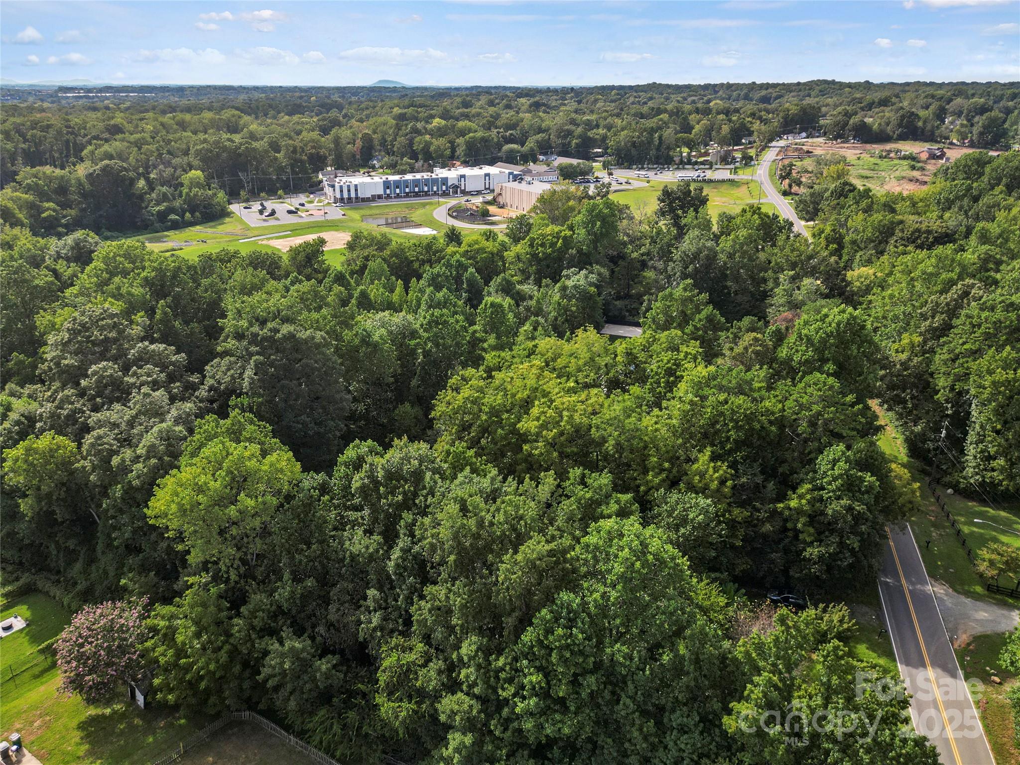 6109 Paw Creek Road Charlotte, NC 28214 - Photo 4 of 18 an aerial view of residential houses with outdoor space and trees