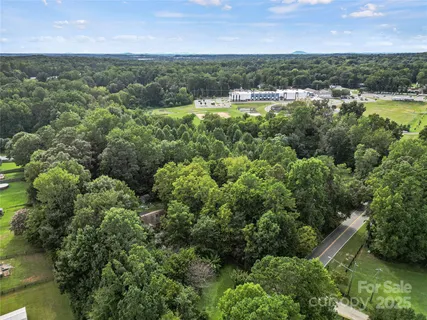an aerial view of a houses with yard and outdoor space