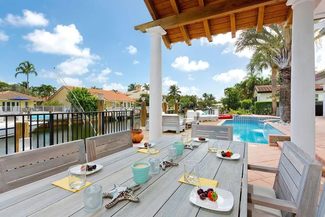 a view of swimming pool with seating area and furniture