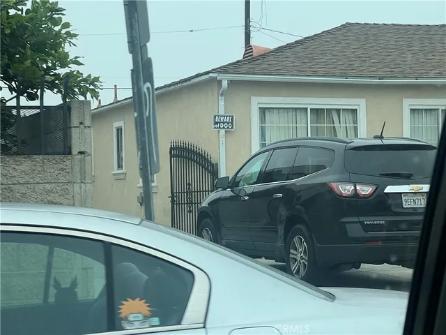 a front view of a house with parking area