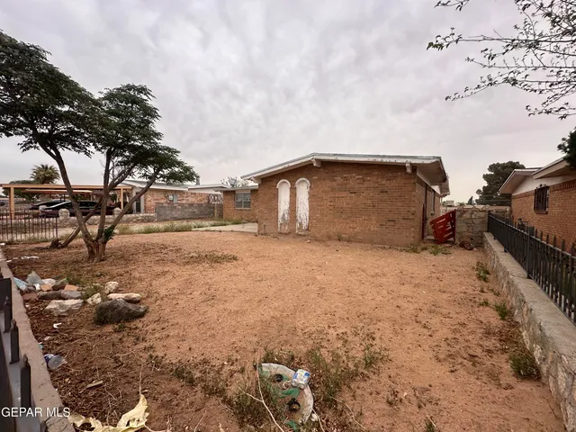 a view of backyard with large trees