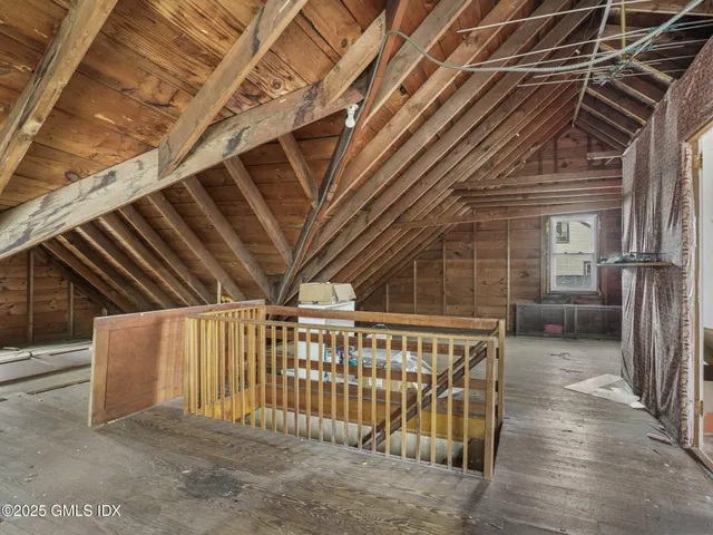 a view of staircase with wooden floor and stairs