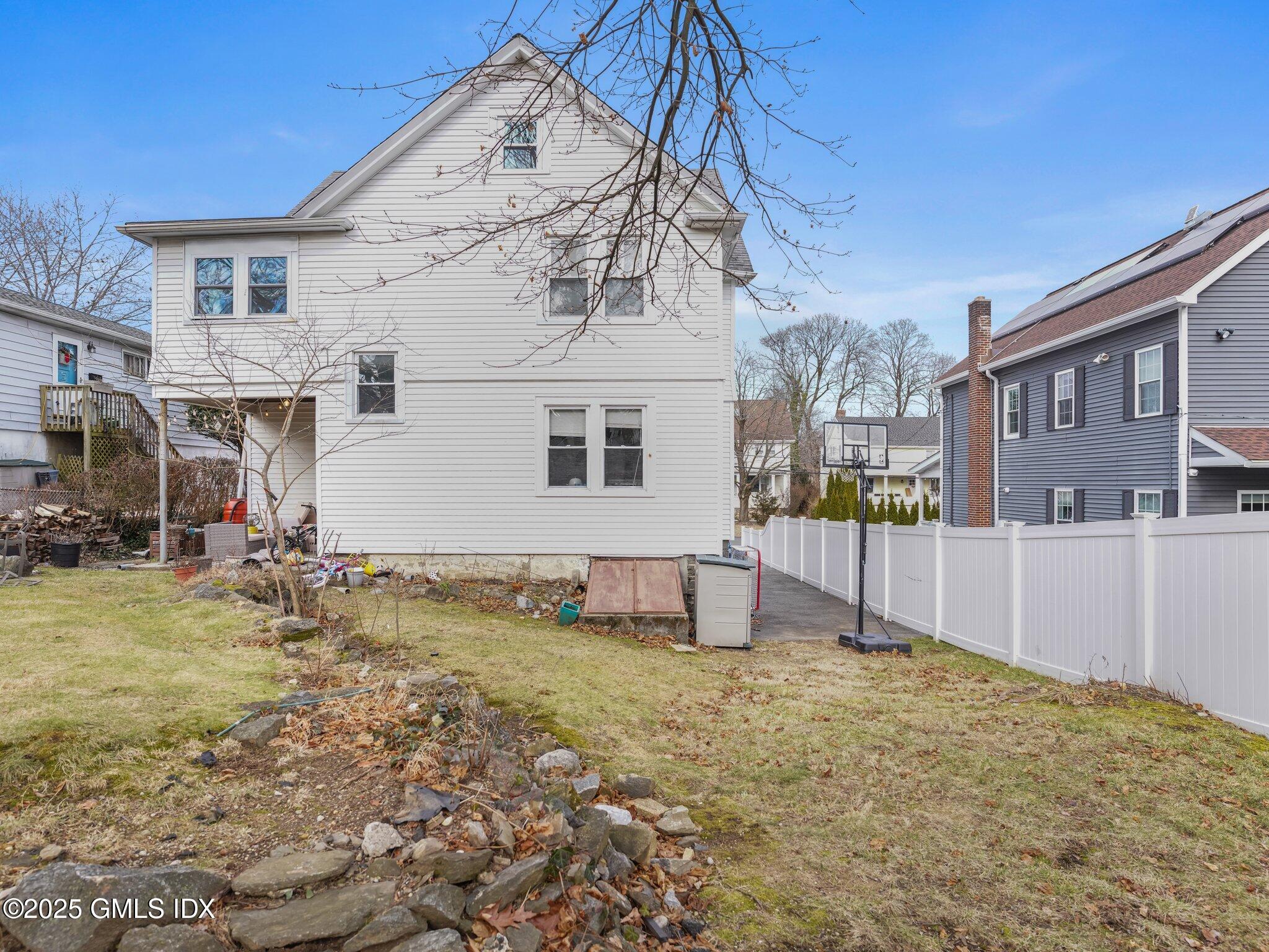 37 High Street, Unit 2 Greenwich, CT 06830 - Photo 21 of 23 a view of a house with a yard