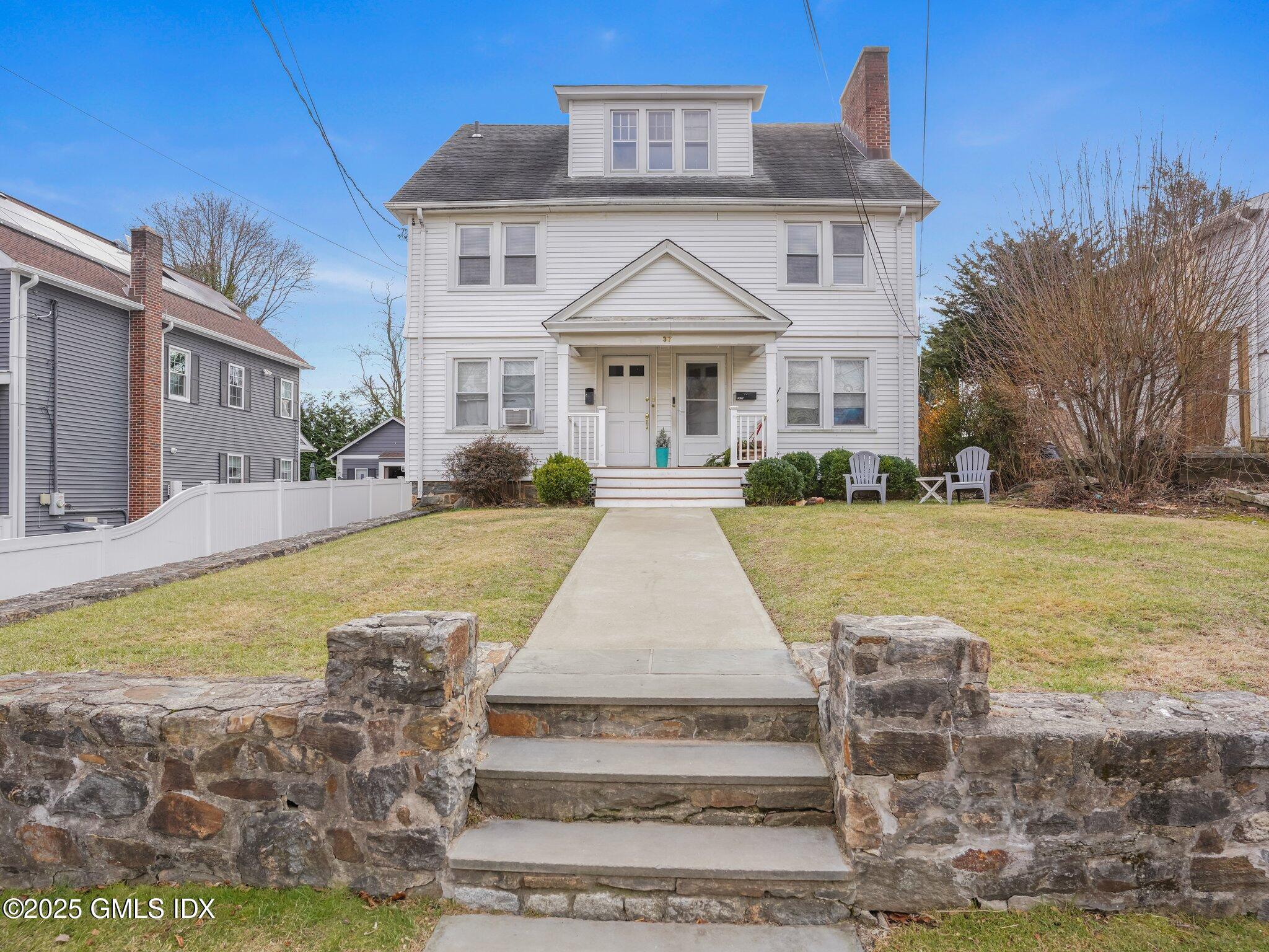 37 High Street, Unit 2 Greenwich, CT 06830 - Photo 23 of 23 a front view of a house with swimming pool