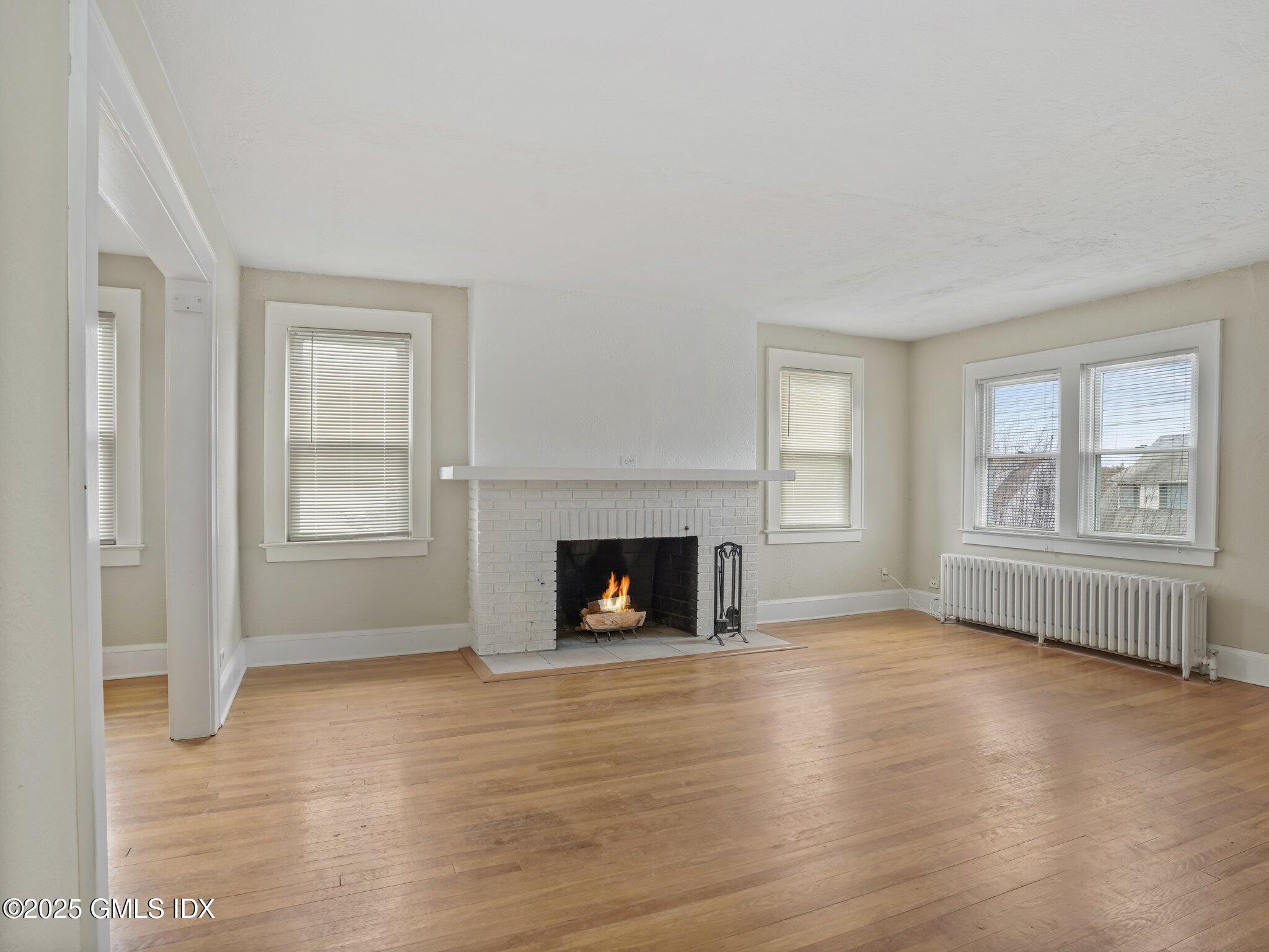 37 High Street, Unit 2 Greenwich, CT 06830 - Photo 3 of 23 a view of livingroom with furniture fireplace and window
