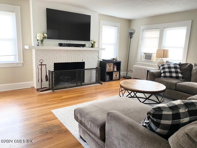 37 High Street, Unit 2 Greenwich, CT 06830 - Photo 4 of 23 a living room with furniture a flat screen tv and a fireplace