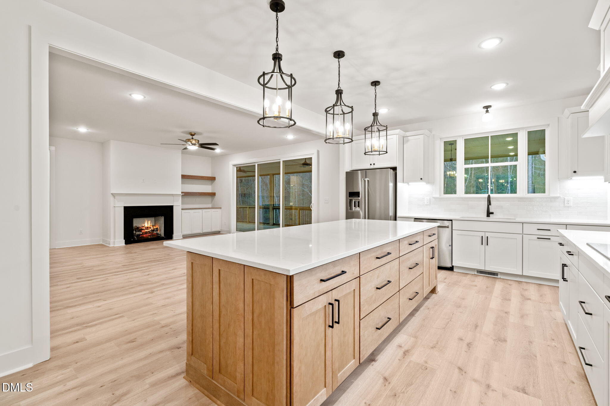 40 Beauview Way Zebulon, NC 27597 - Photo 11 of 52 a large kitchen with granite countertop a large kitchen island white cabinets and wooden floor