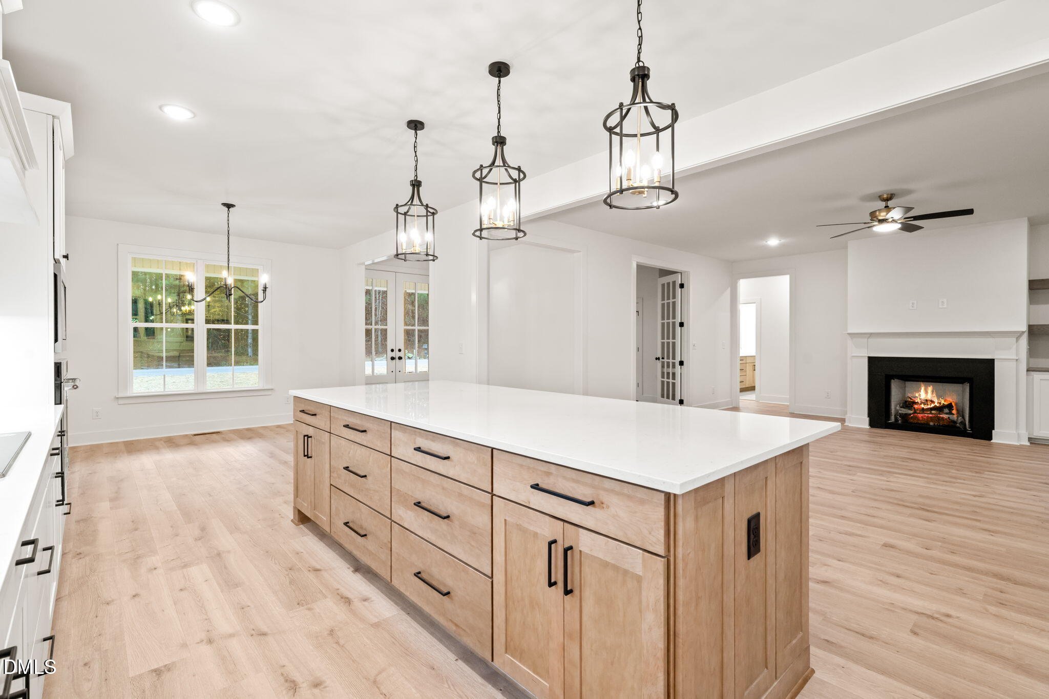 40 Beauview Way Zebulon, NC 27597 - Photo 12 of 52 a kitchen with a sink chandelier and wooden floor