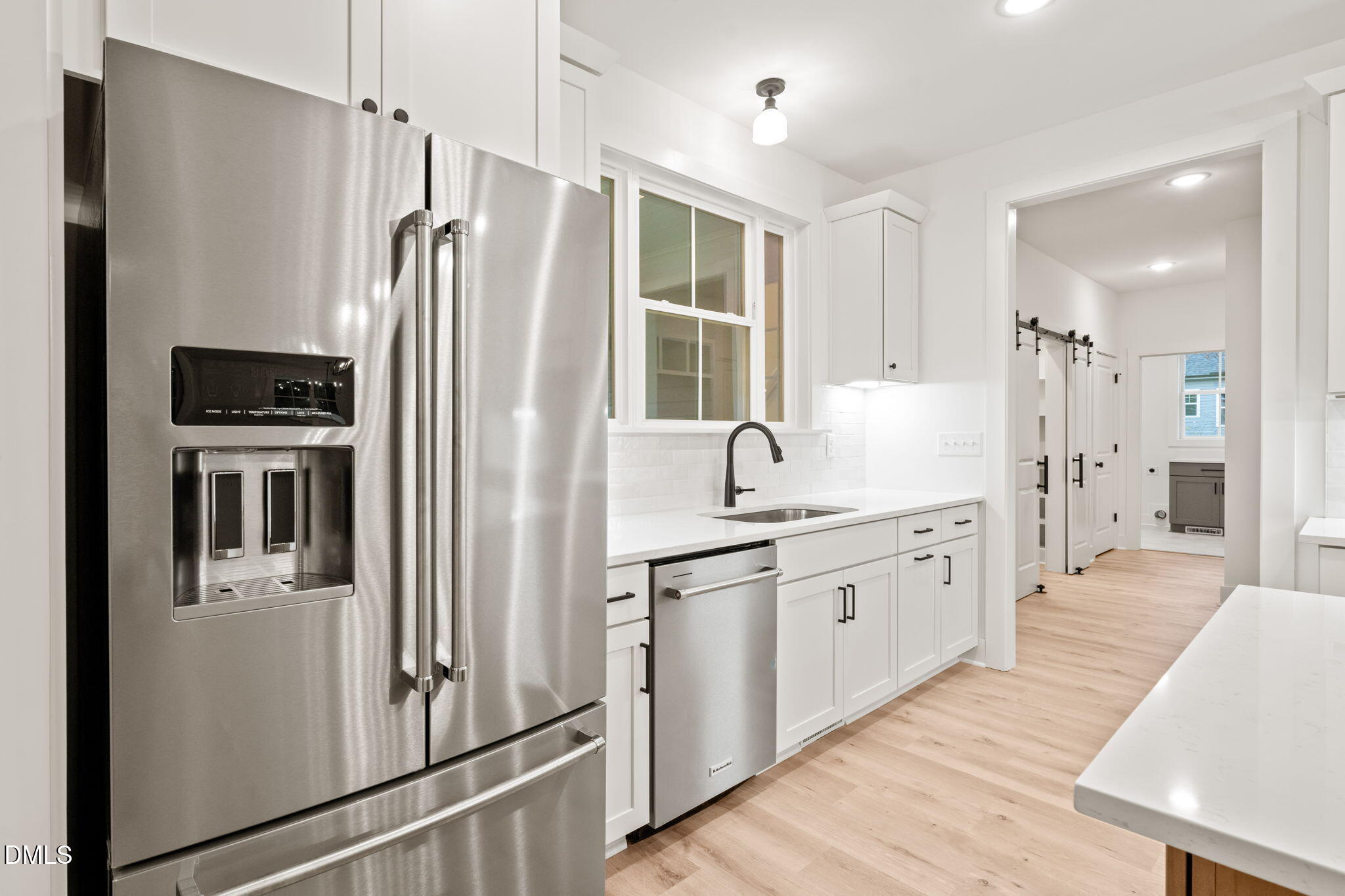 40 Beauview Way Zebulon, NC 27597 - Photo 14 of 52 a kitchen with stainless steel appliances a refrigerator sink and cabinets