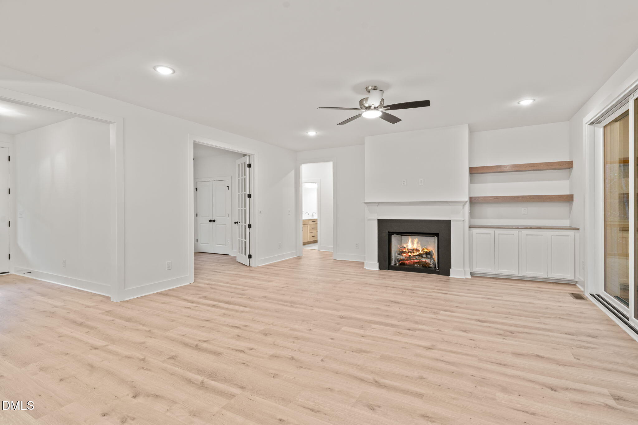 40 Beauview Way Zebulon, NC 27597 - Photo 16 of 52 a view of an empty room with a fireplace