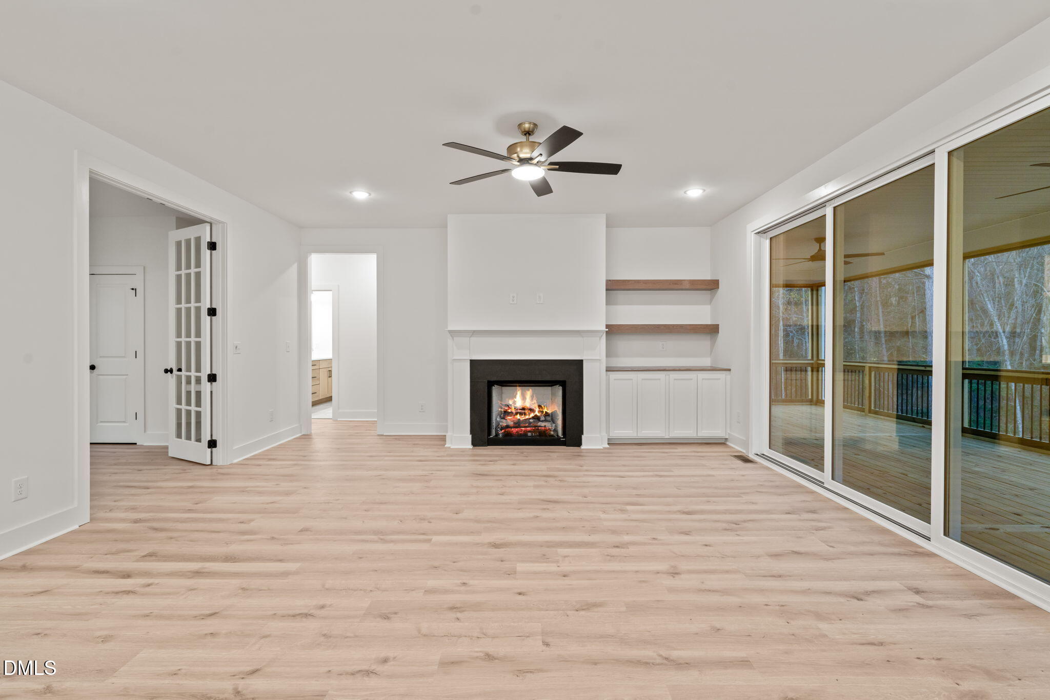 40 Beauview Way Zebulon, NC 27597 - Photo 17 of 52 a view of an empty room with a fireplace and a window