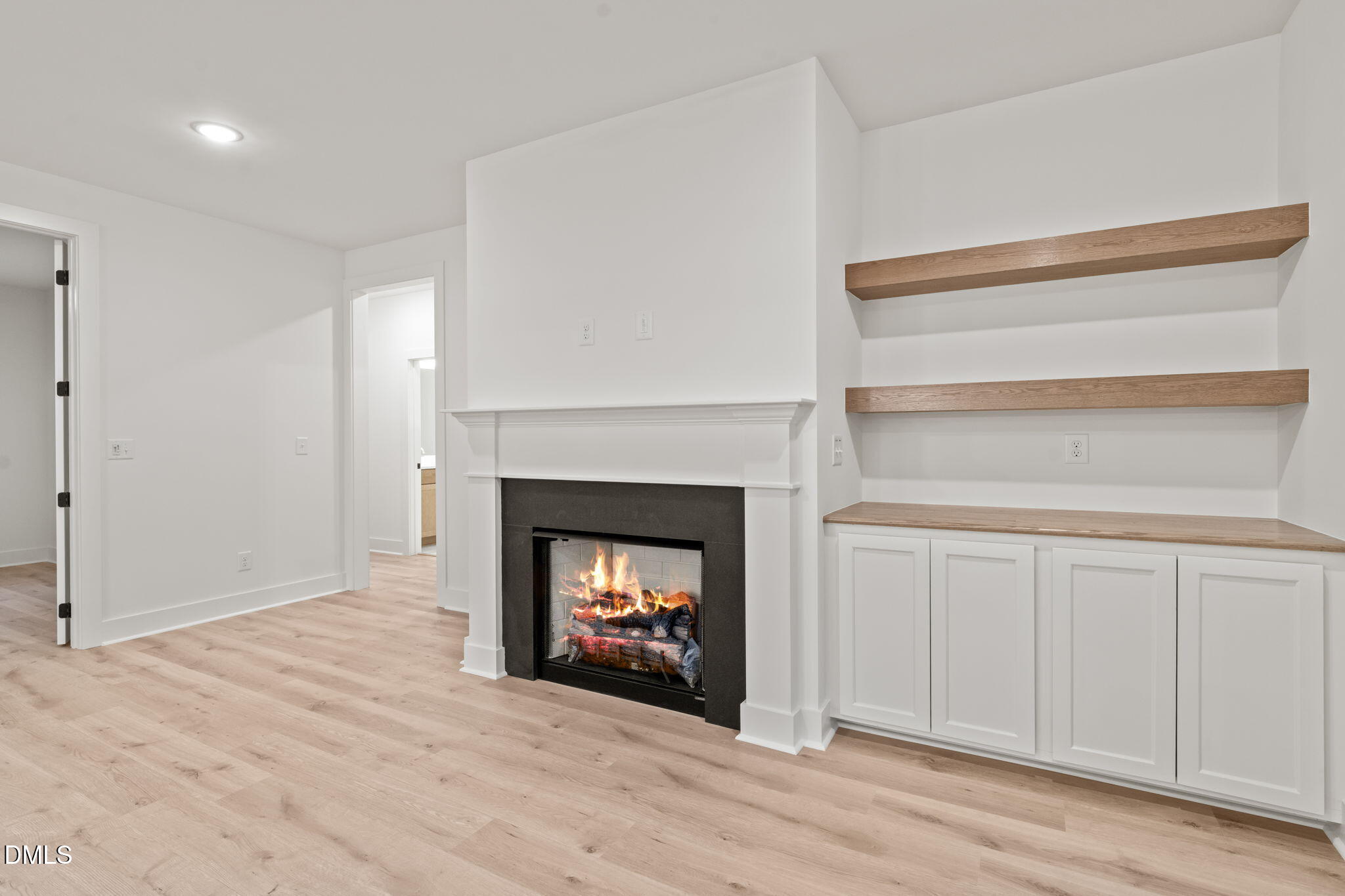 40 Beauview Way Zebulon, NC 27597 - Photo 18 of 52 a view of an empty room with a fireplace