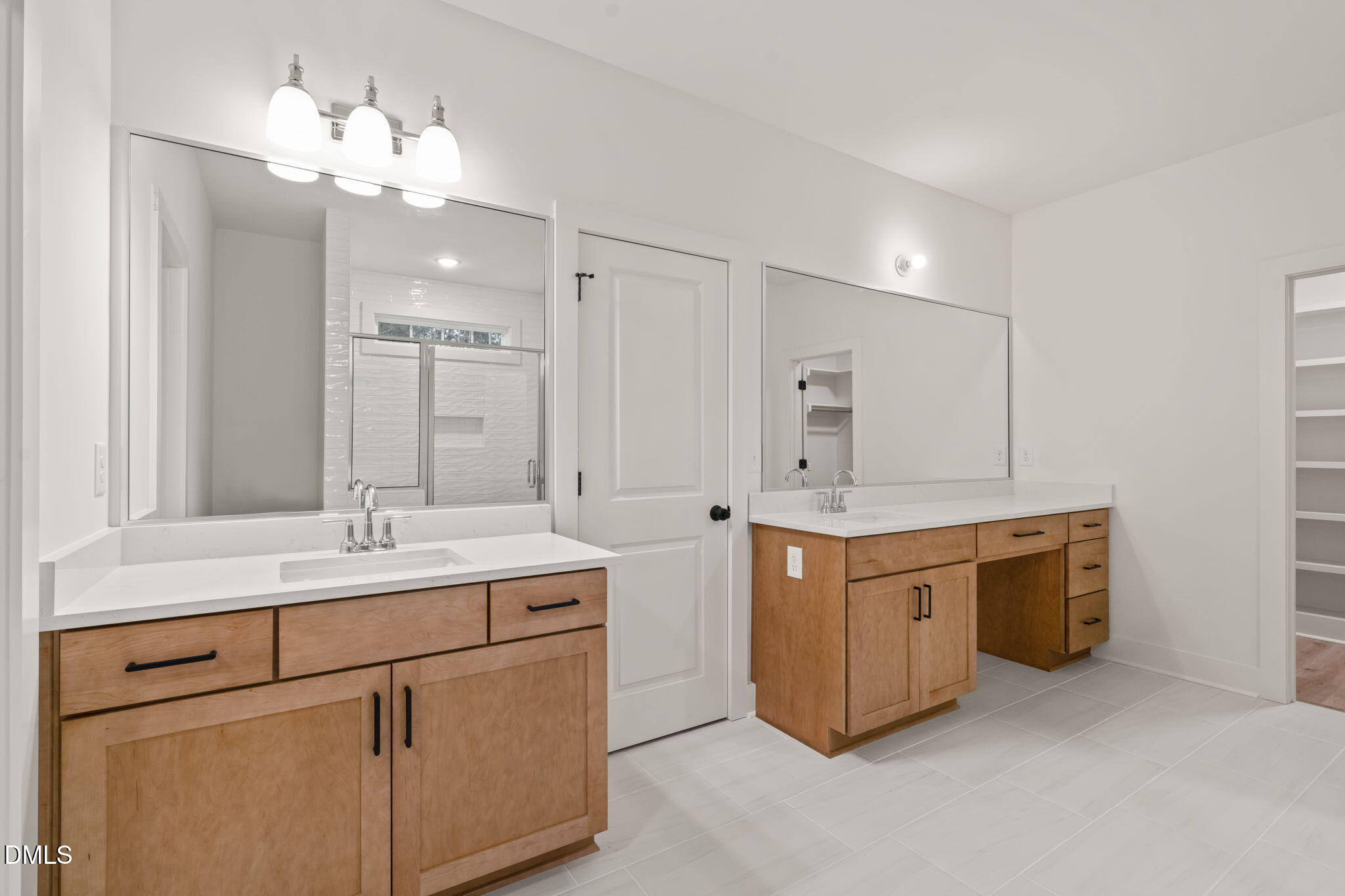 40 Beauview Way Zebulon, NC 27597 - Photo 34 of 52 a bathroom with a double vanity sink mirror and