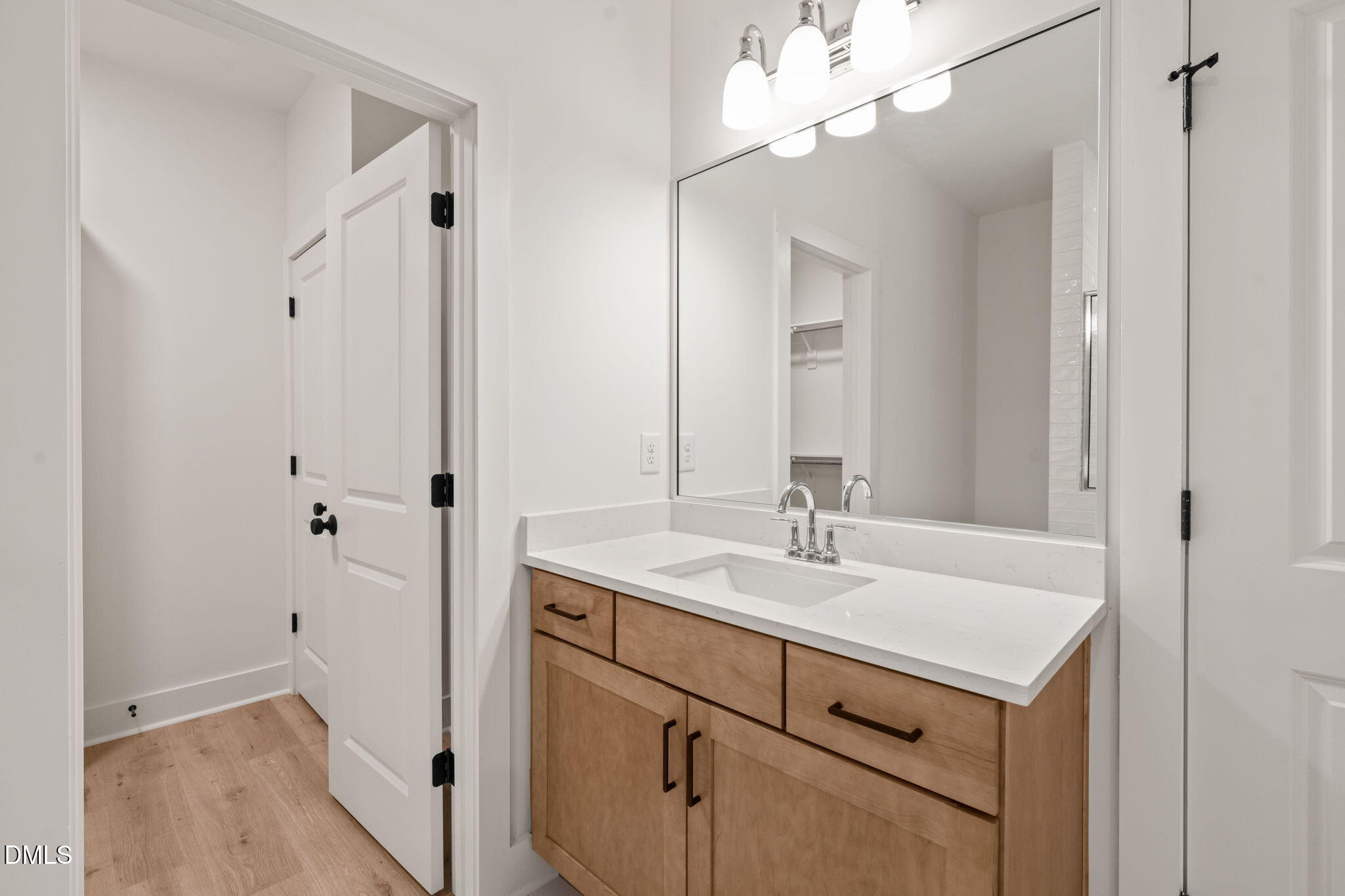 40 Beauview Way Zebulon, NC 27597 - Photo 37 of 52 a bathroom with a sink vanity and a mirror