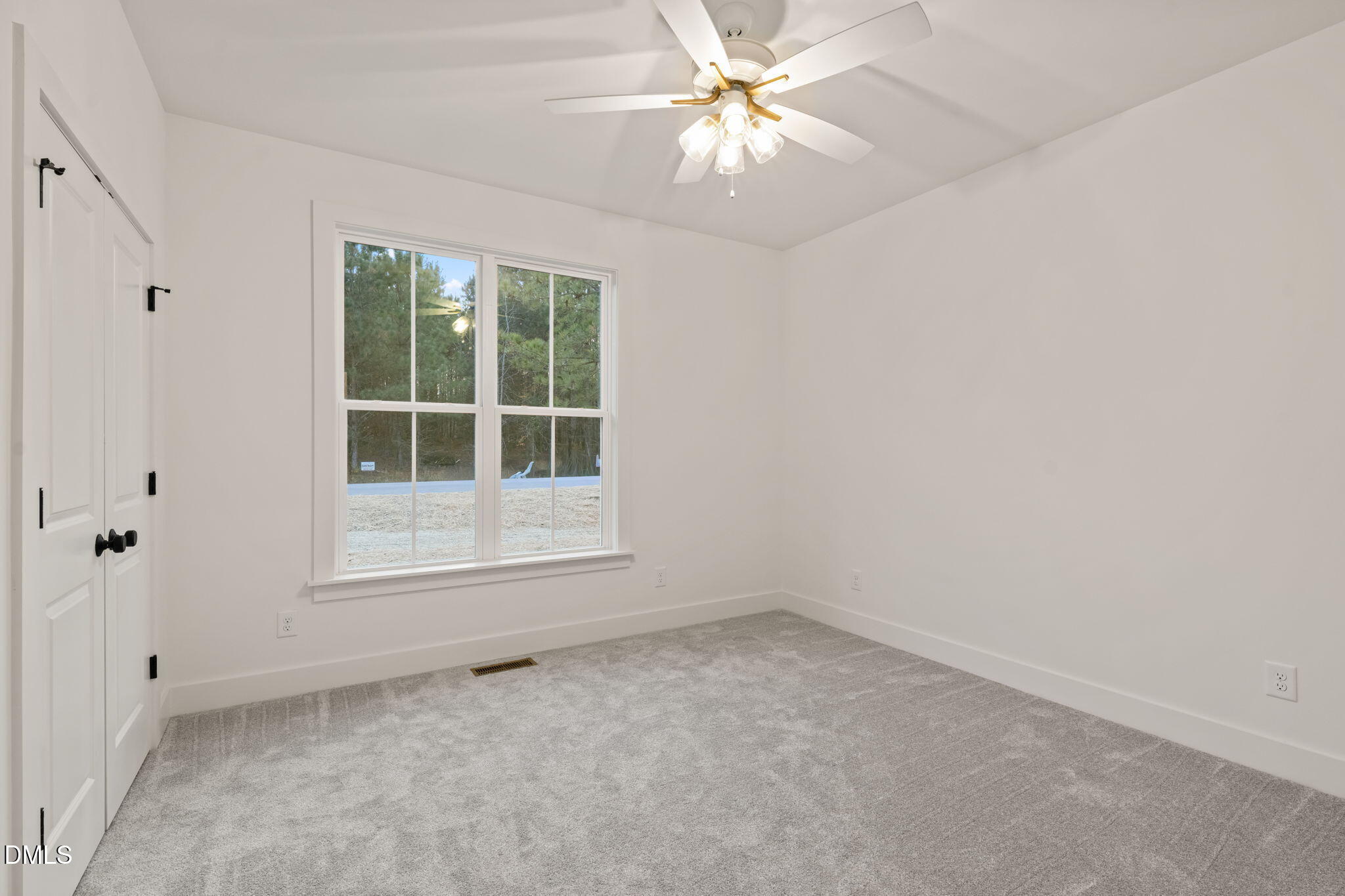 40 Beauview Way Zebulon, NC 27597 - Photo 45 of 52 an empty room with a window