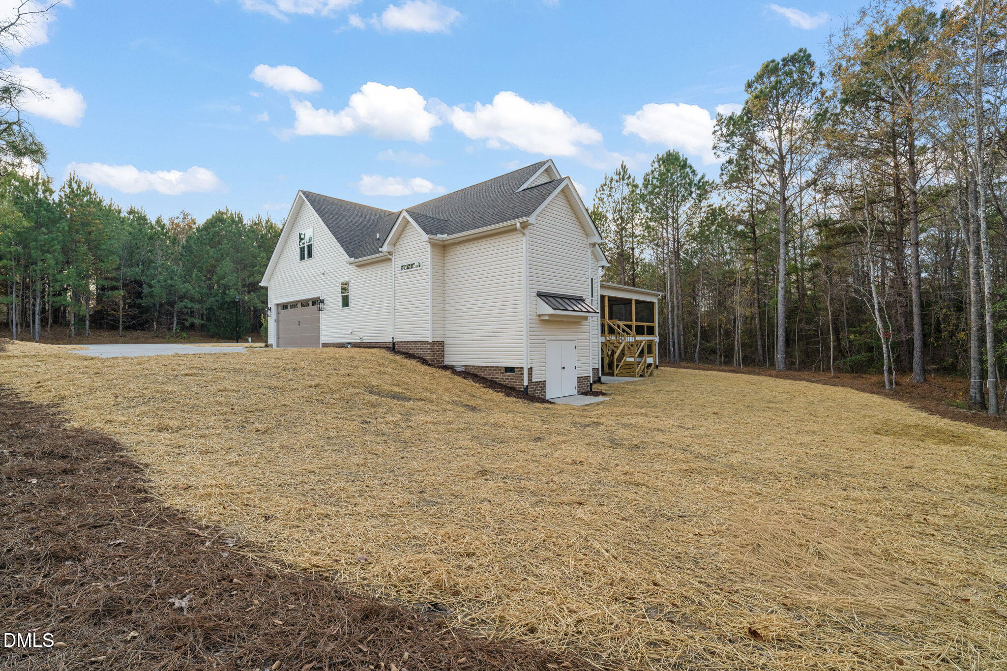 40 Beauview Way Zebulon, NC 27597 - Photo 50 of 52 a backyard of a house with large trees and a yard