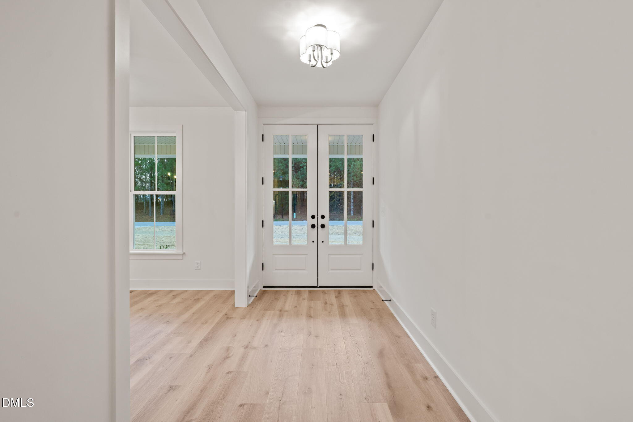 40 Beauview Way Zebulon, NC 27597 - Photo 6 of 52 wooden floor in an empty room with a window
