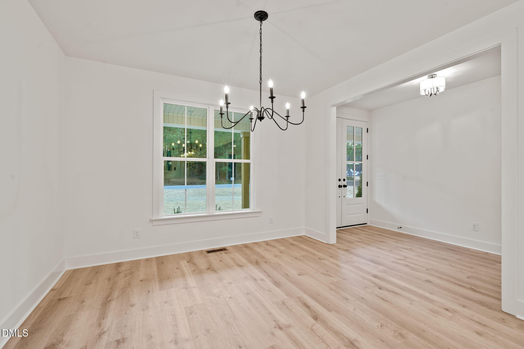 40 Beauview Way Zebulon, NC 27597 - Photo 8 of 52 a view of empty room with wooden floor and fan