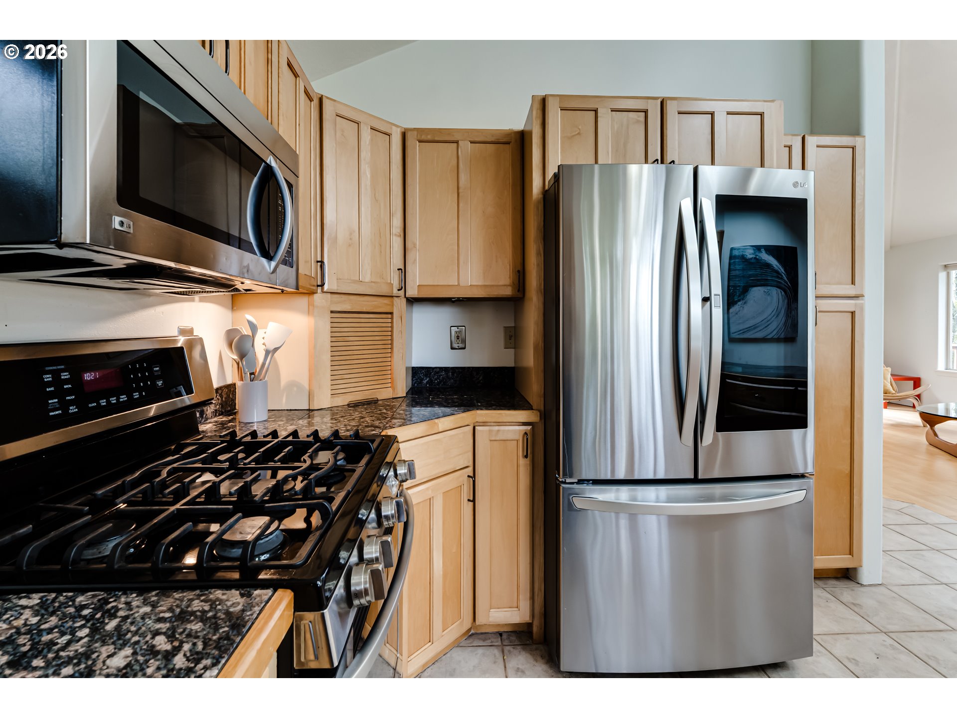 2736 Kismet Way Eugene, OR 97405 - Photo 19 of 48 a kitchen with stainless steel appliances granite countertop a refrigerator and a stove top oven