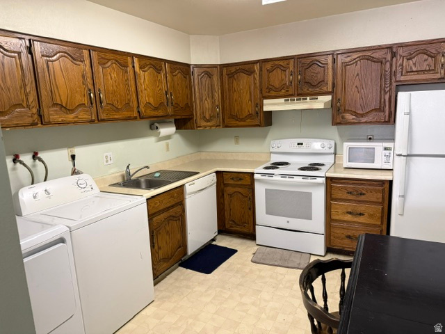 261 North 400 East, Unit 301 Provo, UT 84606 - Photo 4 of 8 Kitchen featuring ample wood cabinetry, laminate countertops, a white electric range, and a stainless steel sink