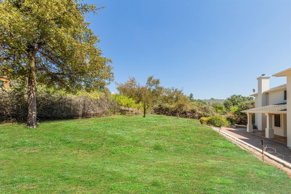 1704 Randolph Ridge Trail Austin, TX 78746 - Photo 6 of 23 Back yard is partially fenced