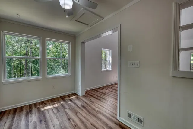 a kitchen with stainless steel appliances granite countertop a sink a stove and cabinets