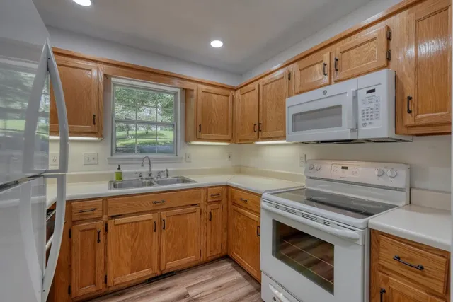 a kitchen with a sink and cabinets