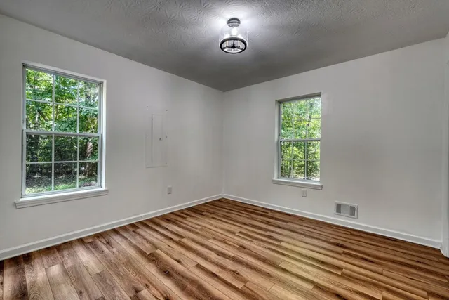 a view of a livingroom with wooden floor