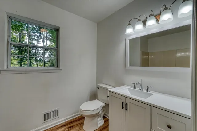 a view of balcony with wooden floor