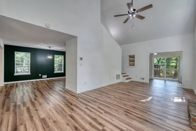 wooden floor in an empty room with a window