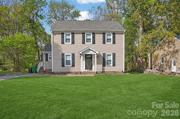 front view of a house with a yard