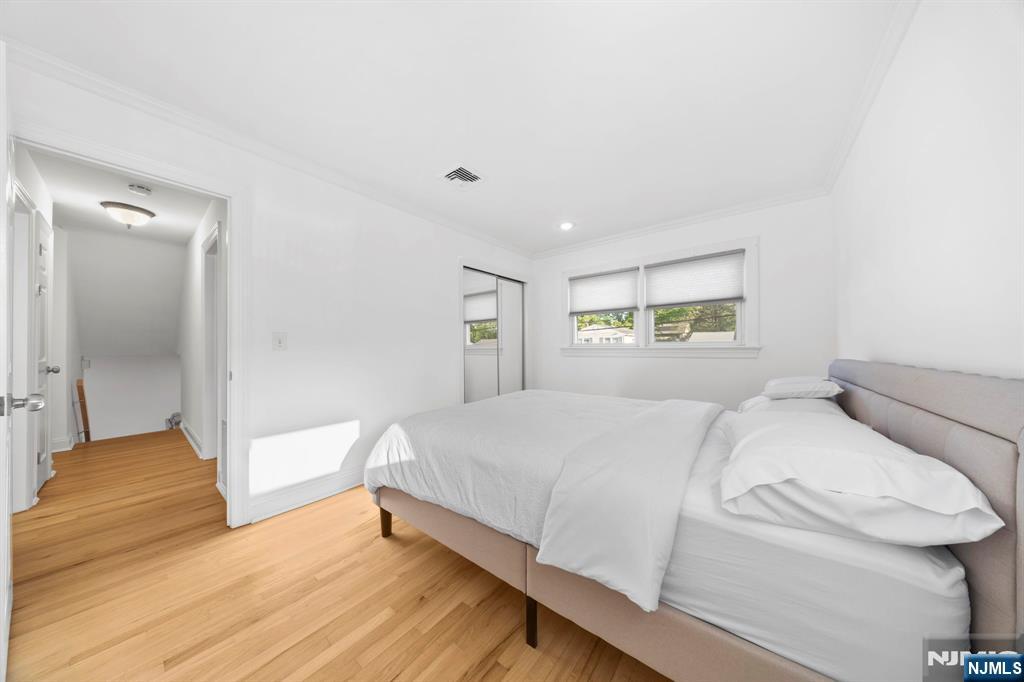 62 Sycamore Road Dumont, NJ 07628 - Photo 20 of 43 a bedroom with a bed and a large window