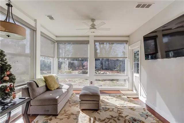 a living room with furniture and a rug