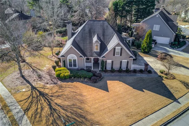 a view of house with yard