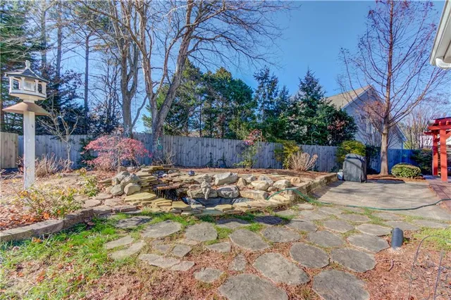 a backyard of a house with lots of green space
