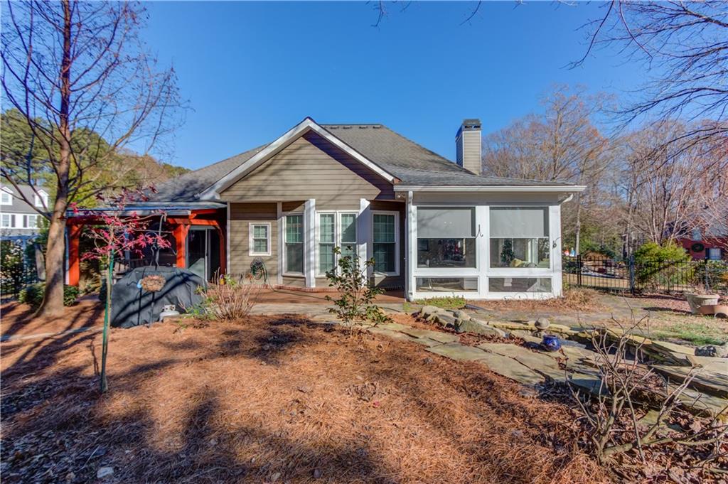 3317 Green Farm Trail Dacula, GA 30019 - Photo 38 of 45 a front view of a house with a garden and patio