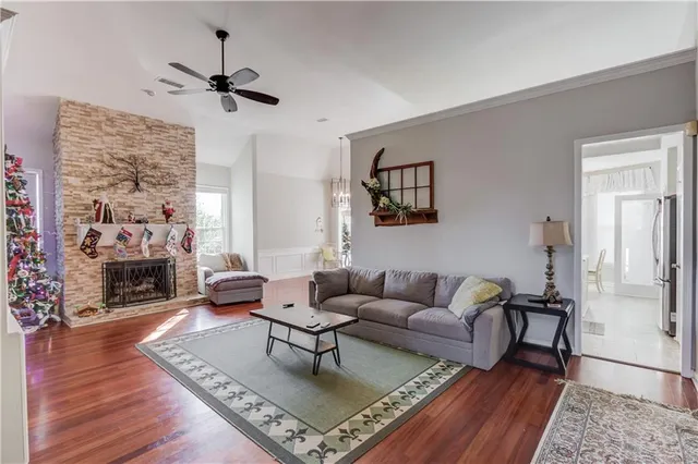 a living room with furniture and a fireplace