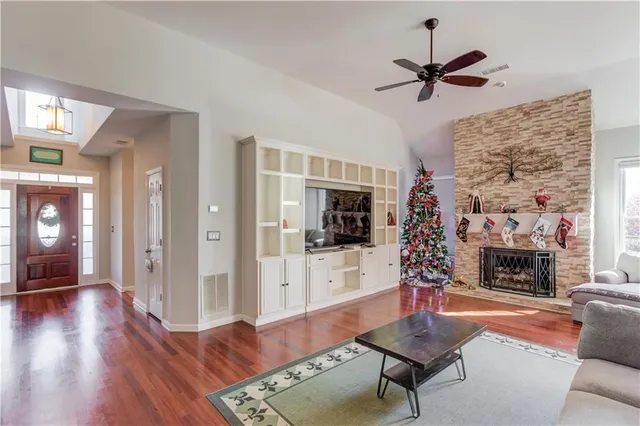 a living room with furniture and a fireplace