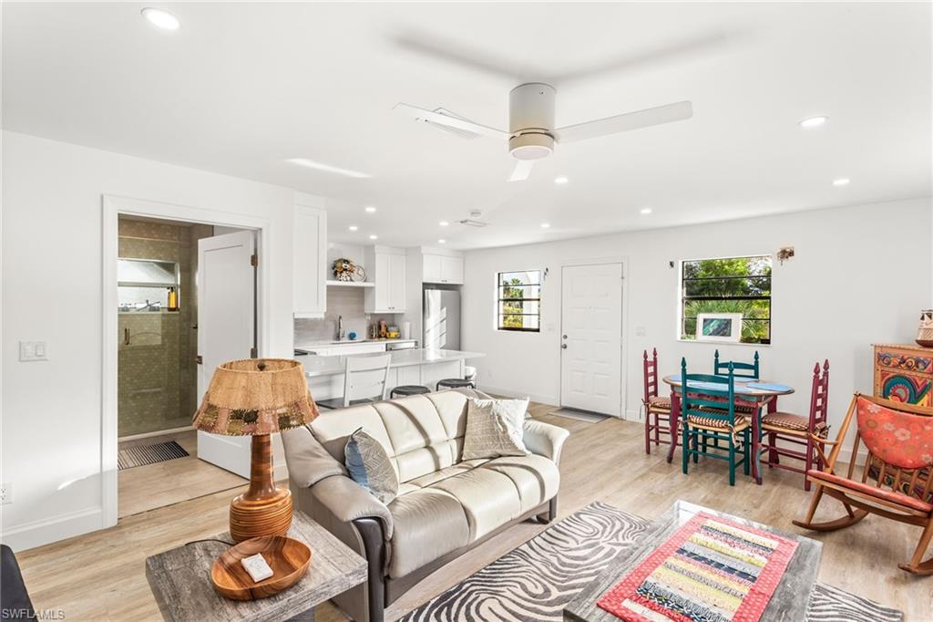 27682 Imperial River Road, Unit CH1 Bonita Springs, FL 34134 - Photo 3 of 24 a living room with furniture and wooden floor