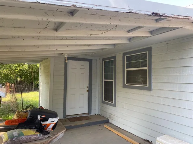 a view of a room with a flat screen tv