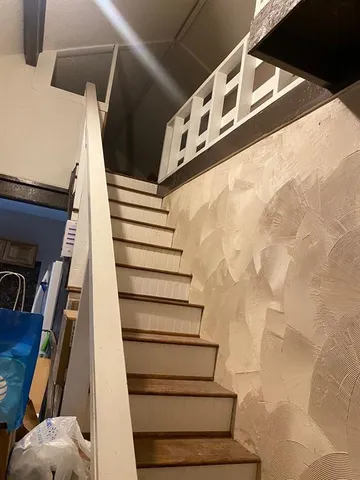 a white refrigerator freezer sitting inside of a kitchen
