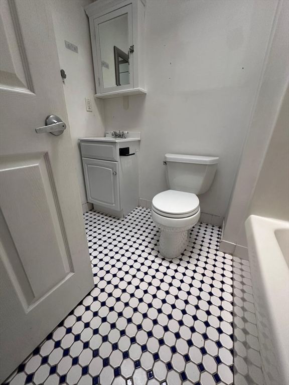 1295 Millbury Street, Unit B Worcester, MA 01607 - Photo 20 of 28 a bathroom with a toilet and a shower