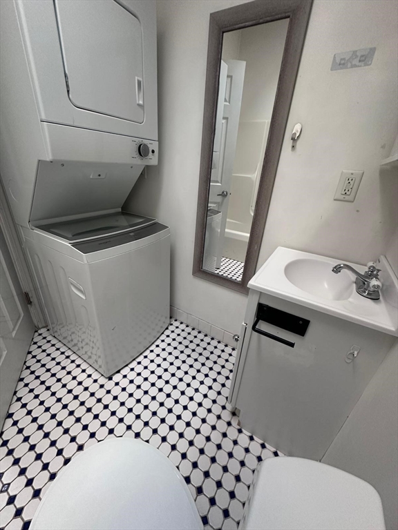 1295 Millbury Street, Unit B Worcester, MA 01607 - Photo 21 of 28 a bathroom with a sink toilet and mirror