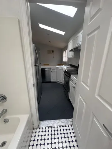 a view of street with parked cars