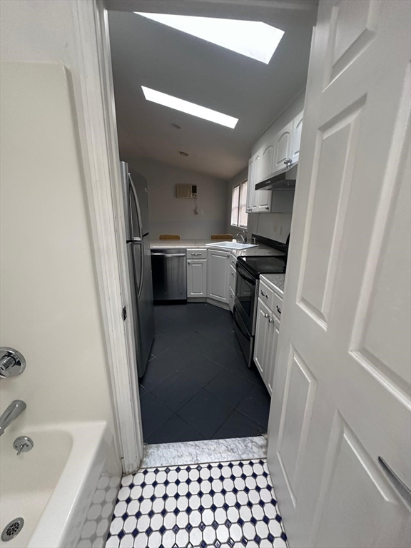 1295 Millbury Street, Unit B Worcester, MA 01607 - Photo 23 of 28 a bathroom with a sink a toilet and shower