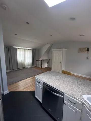 a kitchen with a stove and a sink