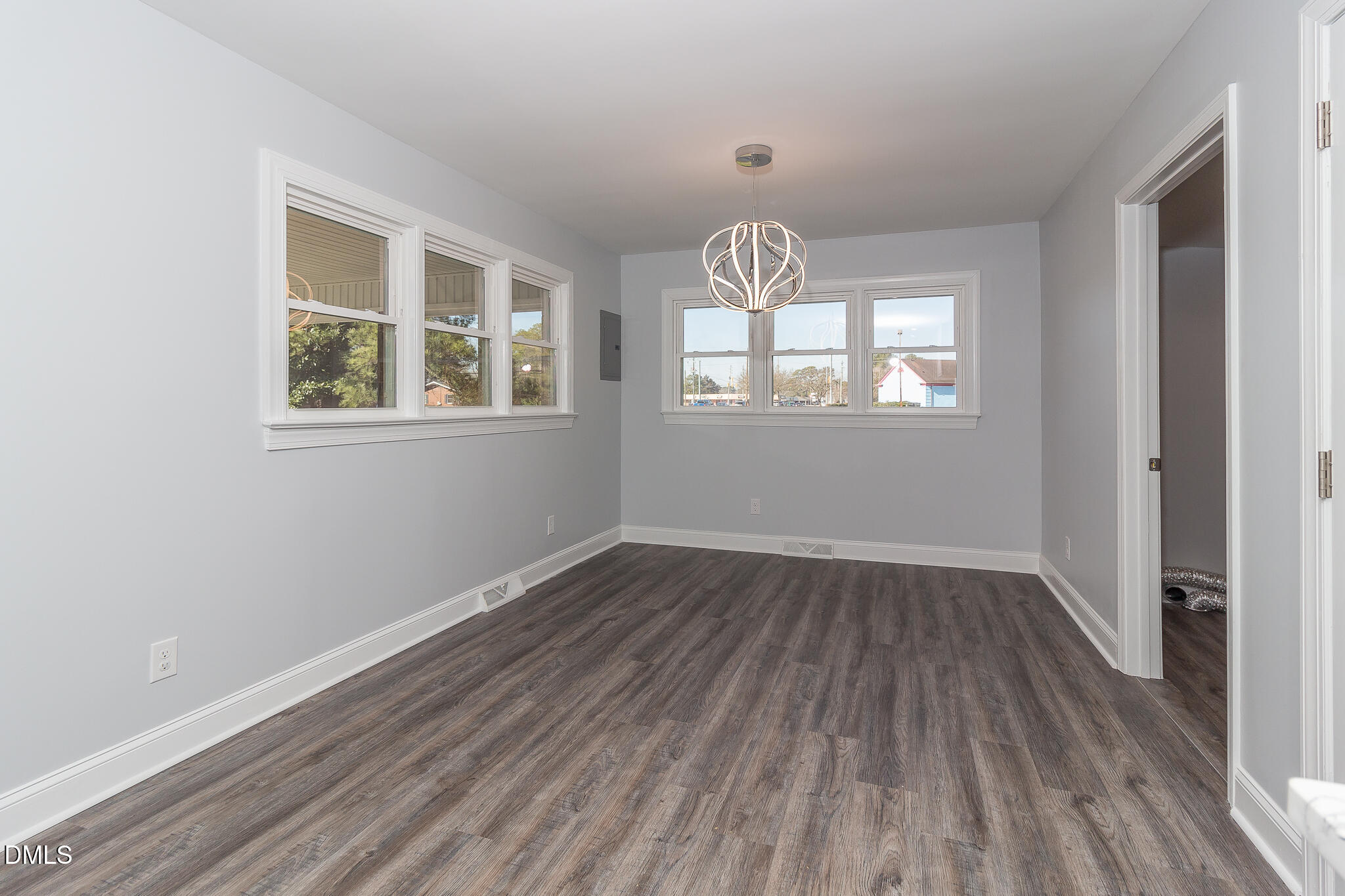 107 East New Hope Road Goldsboro, NC 27534 - Photo 12 of 33 an empty room with wooden floor and windows