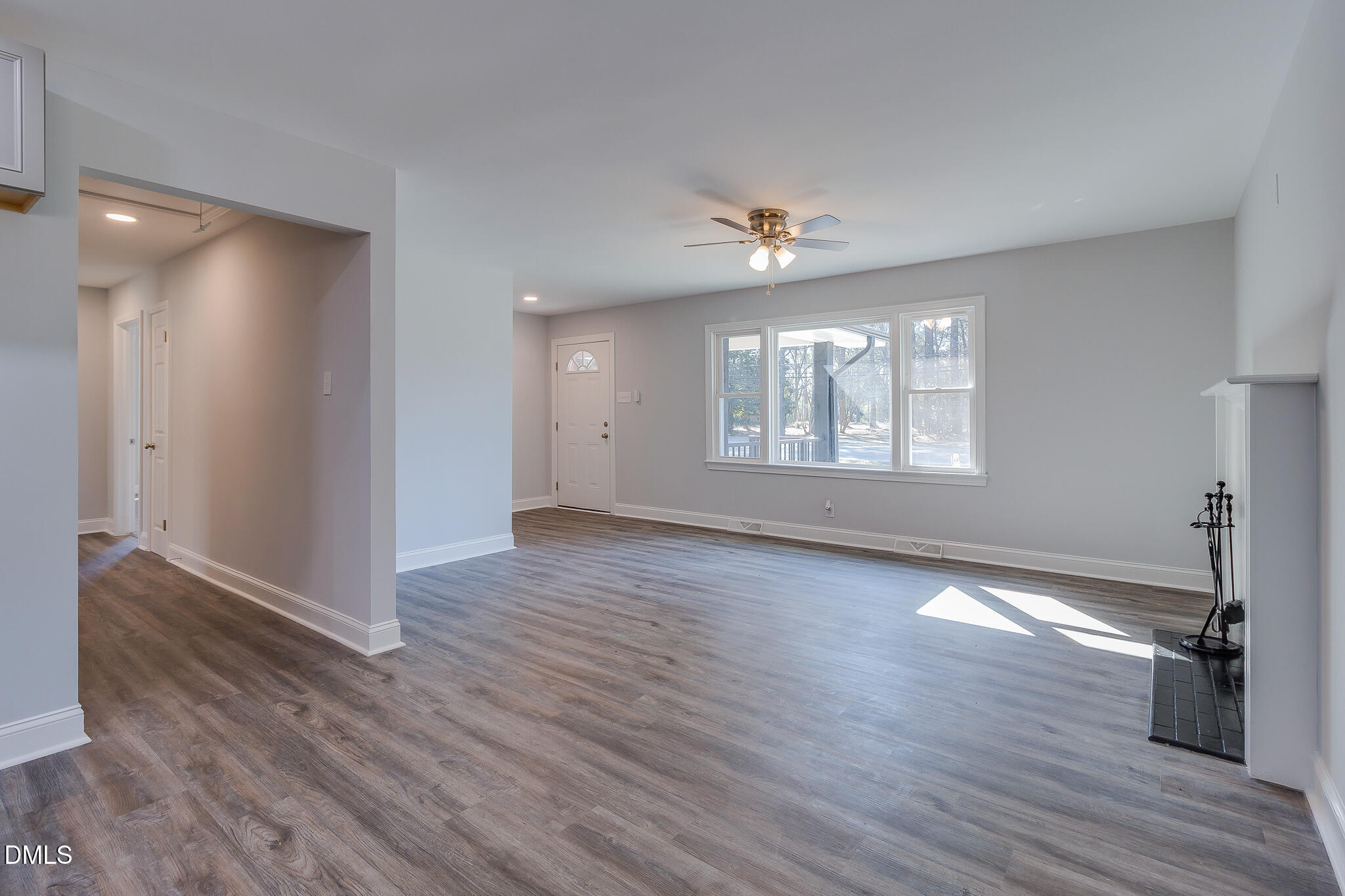 107 East New Hope Road Goldsboro, NC 27534 - Photo 17 of 33 a view of an empty room with a window and wooden floor